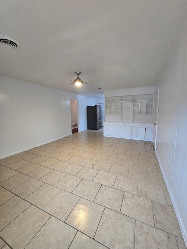1714 Laurel Rd, Gainesville, TX 76240 - spare room featuring ceiling fan and baseboards