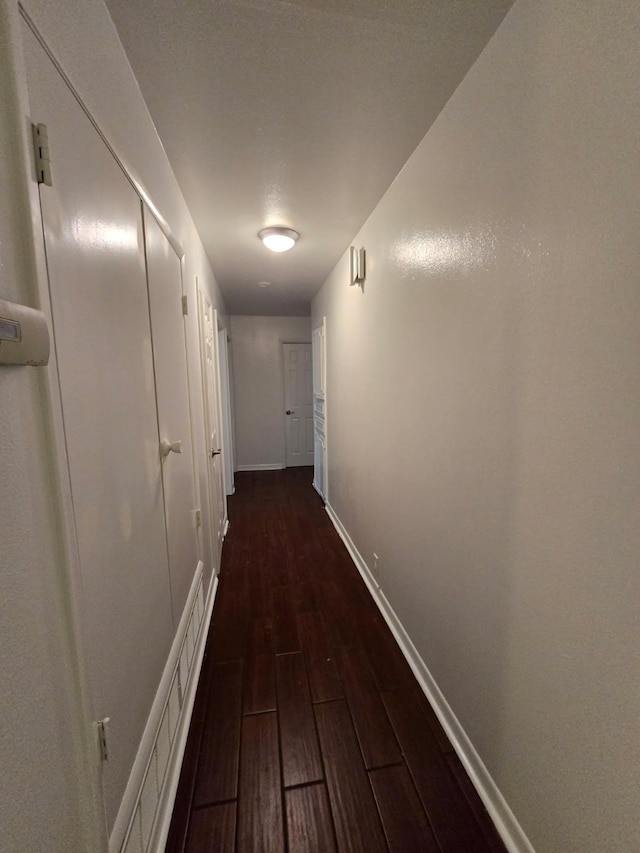 1714 Laurel Rd, Gainesville, TX 76240 - corridor featuring dark wood-type flooring and baseboards