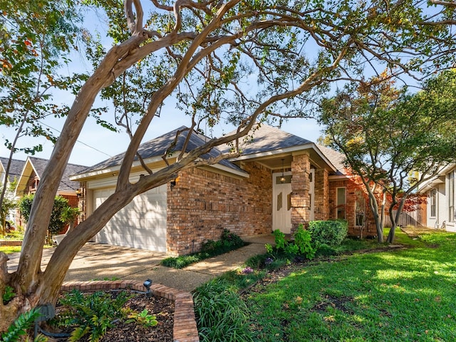 view of front of property with a garage and a front lawn