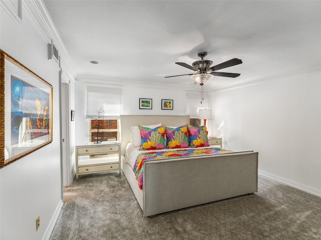 bedroom with carpet floors, ornamental molding, and ceiling fan