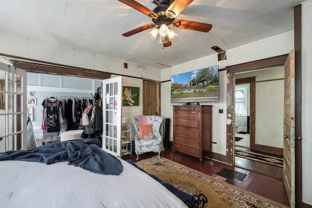 bedroom featuring dark hardwood / wood-style floors, french doors, and ceiling fan