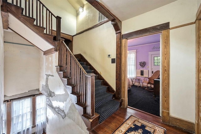 stairs featuring hardwood / wood-style flooring