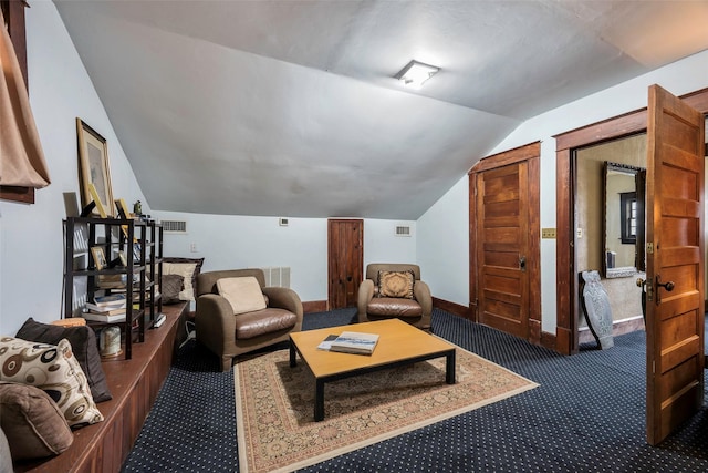 carpeted living room with vaulted ceiling