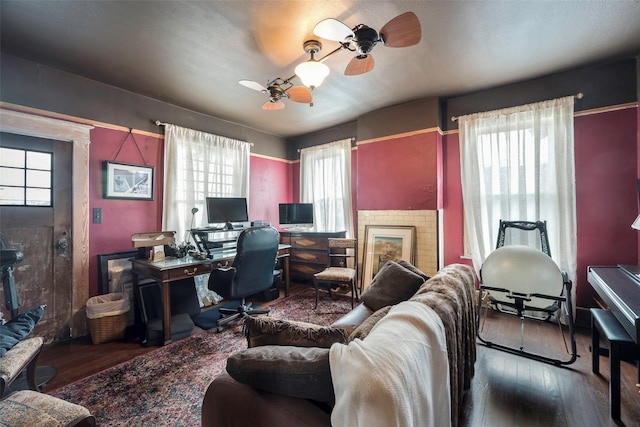 office space featuring wood-type flooring and ceiling fan