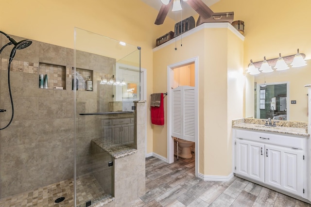 808 Majestic Oaks Ct, Mansfield, TX 76063 - bathroom with a shower stall, vanity, wood finished floors, and a ceiling fan