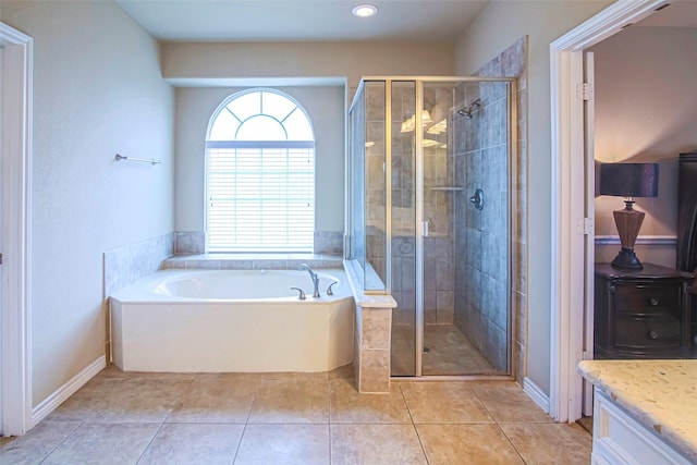 bathroom with independent shower and bath, vanity, and tile patterned floors