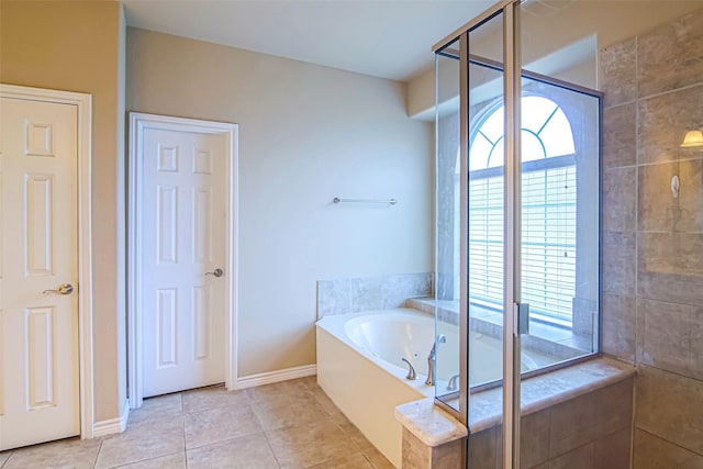 bathroom with tile patterned floors and independent shower and bath