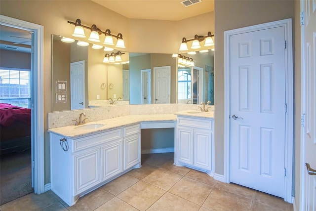 bathroom with tile patterned flooring and vanity