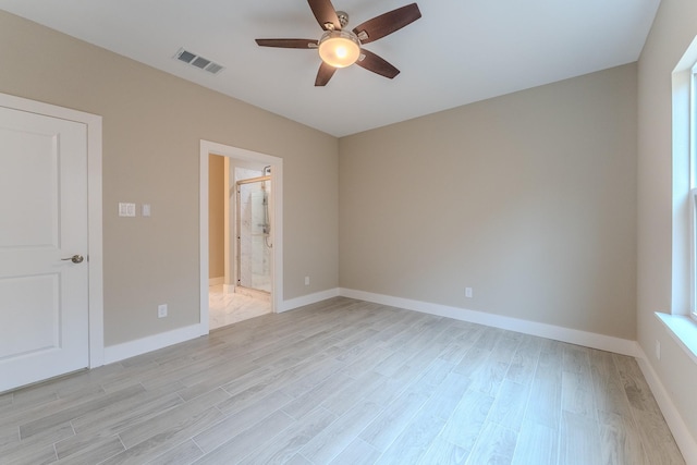 empty room featuring ceiling fan and light wood-type flooring