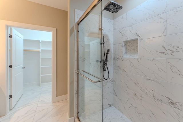 bathroom with a shower with shower door