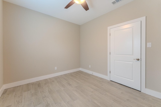 spare room featuring ceiling fan and light hardwood / wood-style floors