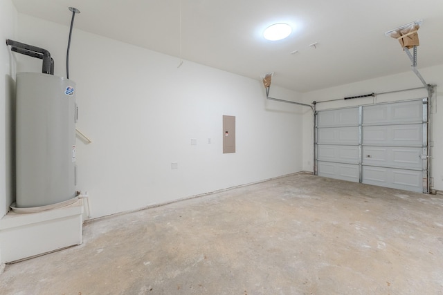 garage featuring electric panel and electric water heater