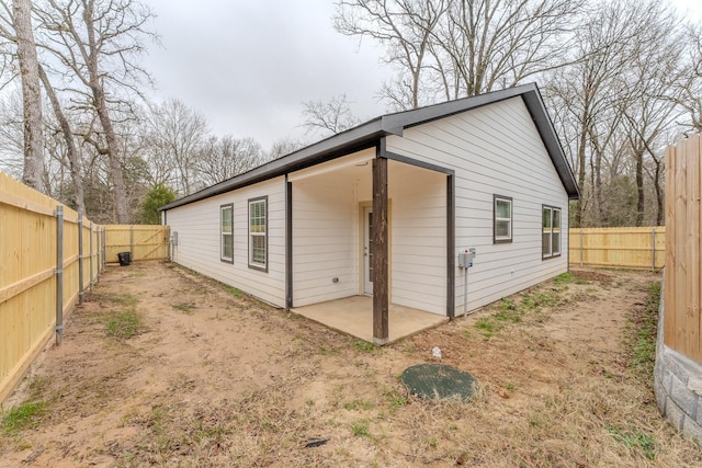 back of property with a patio area