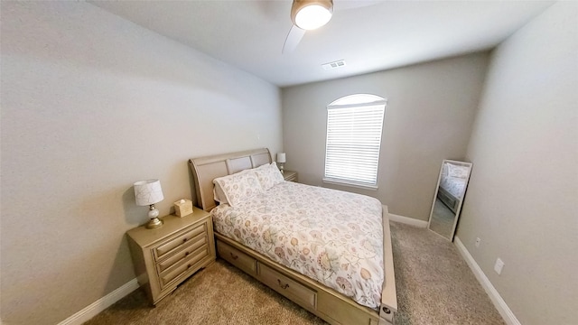 bedroom featuring light carpet and ceiling fan