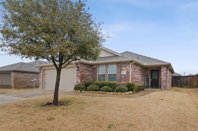 ranch-style house featuring a garage and a front yard