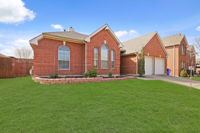 view of front of house featuring a garage and a front yard