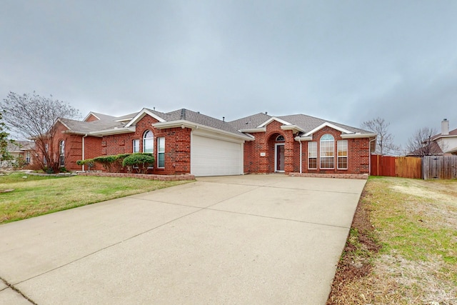 single story home with a garage and a front yard