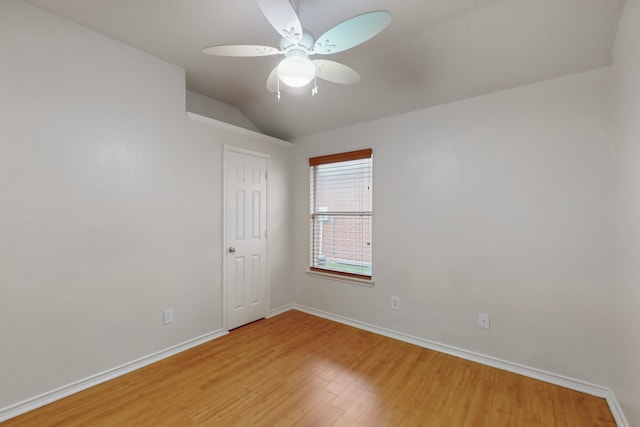 unfurnished room featuring ceiling fan, wood-type flooring, and vaulted ceiling