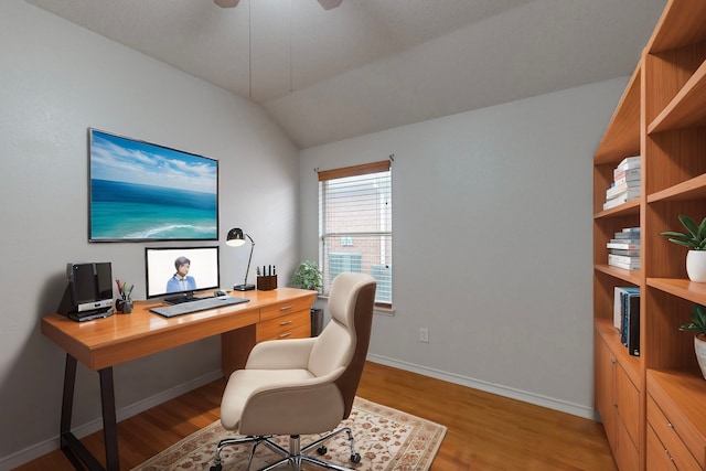 office area featuring lofted ceiling, ceiling fan, and light wood-type flooring