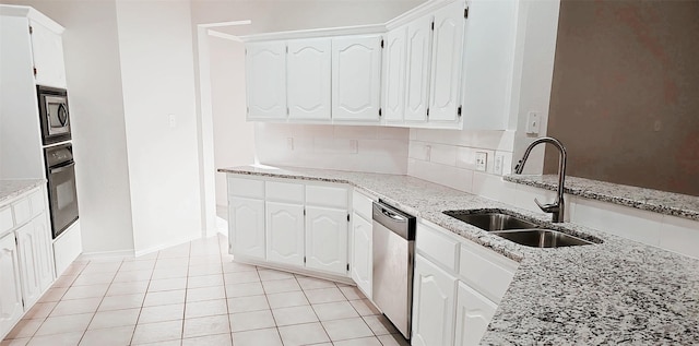3821 Red Oak St, Sachse, TX 75048 - kitchen with a sink, appliances with stainless steel finishes, light stone counters, and white cabinetry