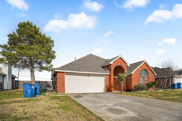 ranch-style house with a garage and a front lawn