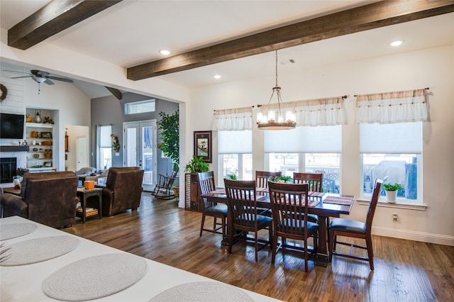 dining space featuring dark wood-type flooring, ceiling fan with notable chandelier, french doors, and vaulted ceiling with beams