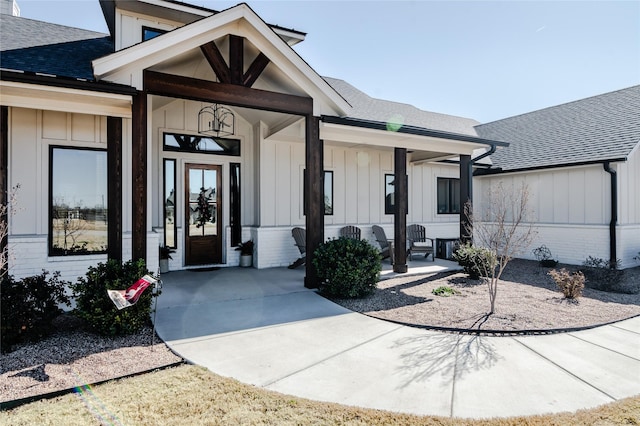 view of exterior entry featuring a porch