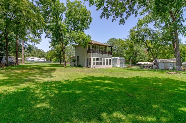 view of yard with a sunroom