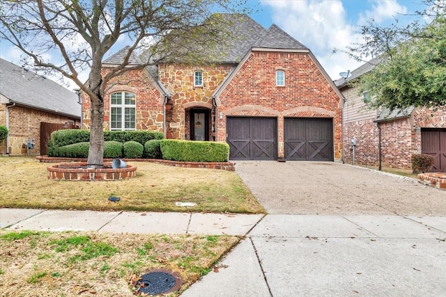 tudor home featuring a front lawn