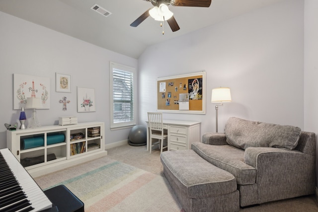 interior space featuring vaulted ceiling, baseboards, visible vents, and a ceiling fan