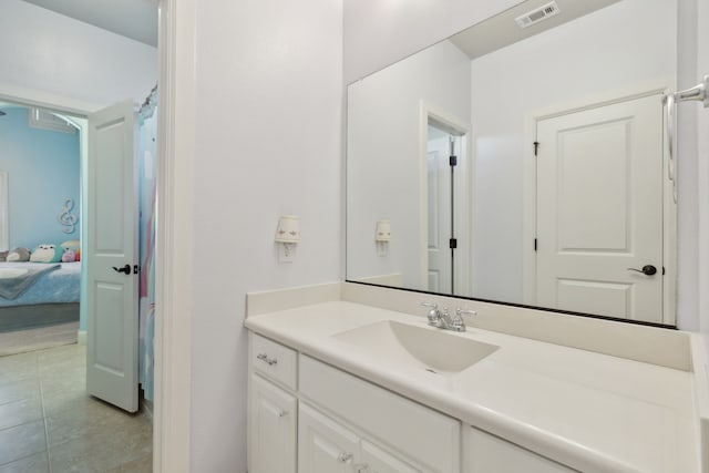 full bath with ensuite bathroom, tile patterned flooring, vanity, and visible vents