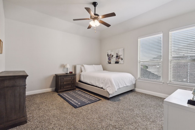 carpeted bedroom featuring a ceiling fan and baseboards