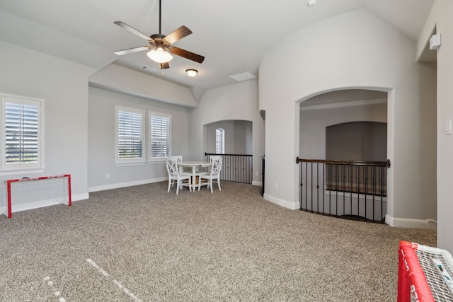 dining area with lofted ceiling, visible vents, a ceiling fan, carpet flooring, and baseboards