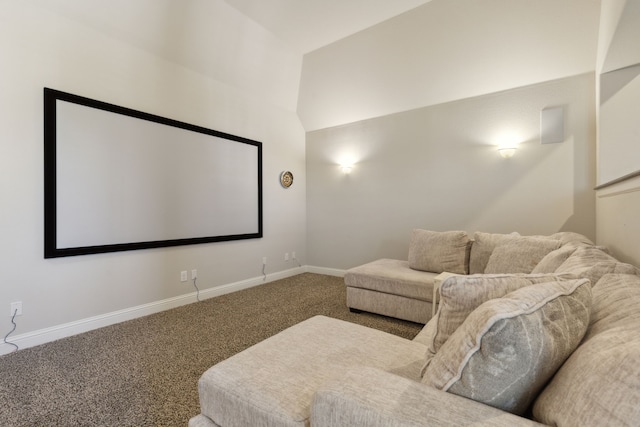 home theater featuring lofted ceiling, carpet flooring, and baseboards