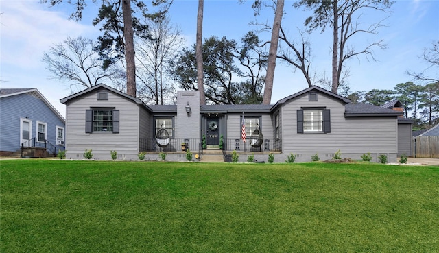 rear view of house with a yard