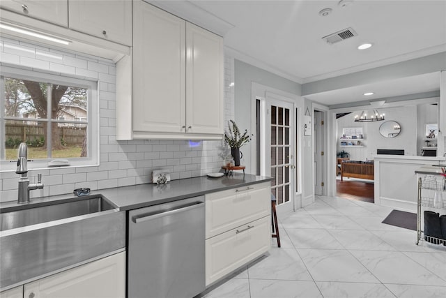 kitchen featuring sink, dishwasher, white cabinetry, tasteful backsplash, and ornamental molding