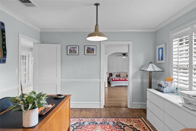 home office featuring crown molding, ceiling fan, and dark hardwood / wood-style flooring