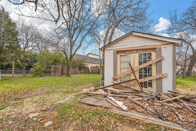 view of outbuilding featuring a lawn