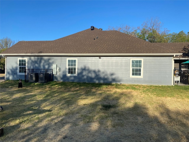 rear view of house with a lawn