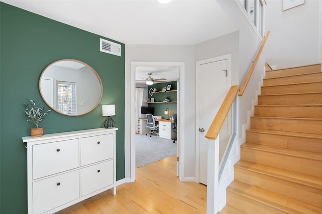 staircase featuring wood-type flooring