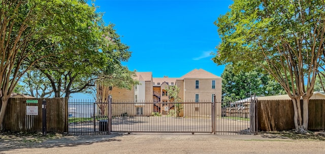 view of gate featuring fence