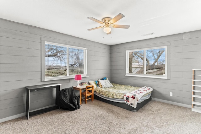 carpeted bedroom featuring ceiling fan