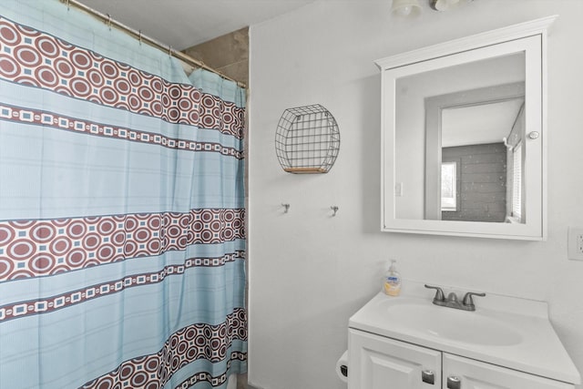 bathroom with vanity and walk in shower