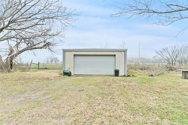 garage featuring a lawn