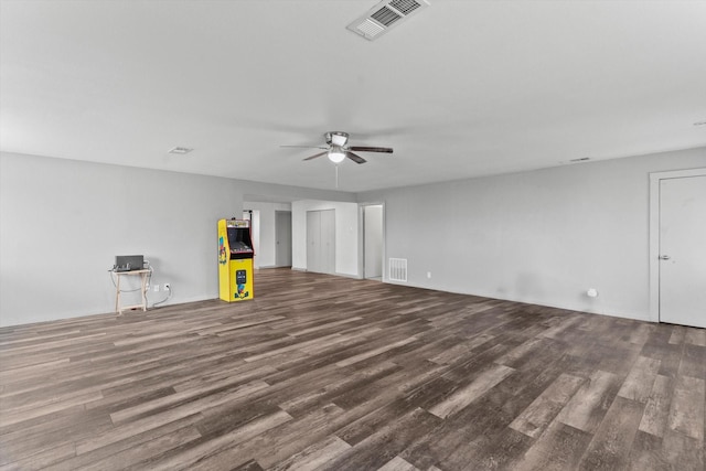 interior space with dark hardwood / wood-style flooring and ceiling fan