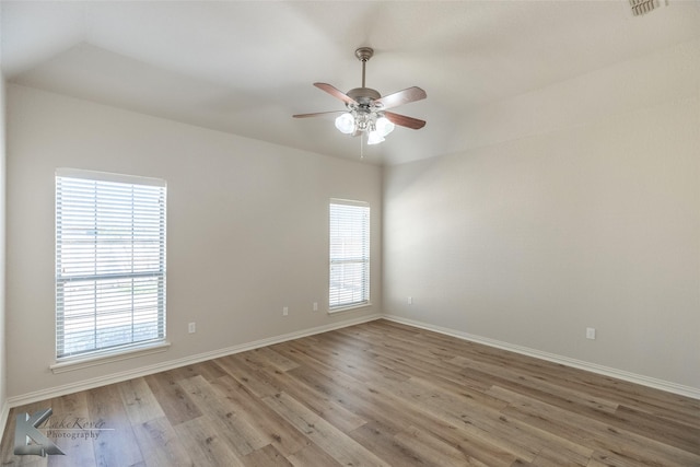 unfurnished room featuring ceiling fan and light wood-type flooring