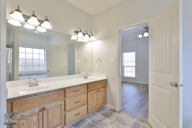 bathroom featuring vanity, tile patterned flooring, and ceiling fan