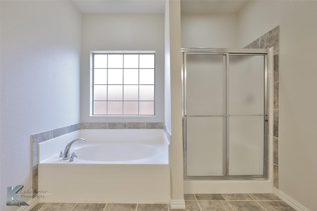 bathroom with tile patterned flooring and plus walk in shower