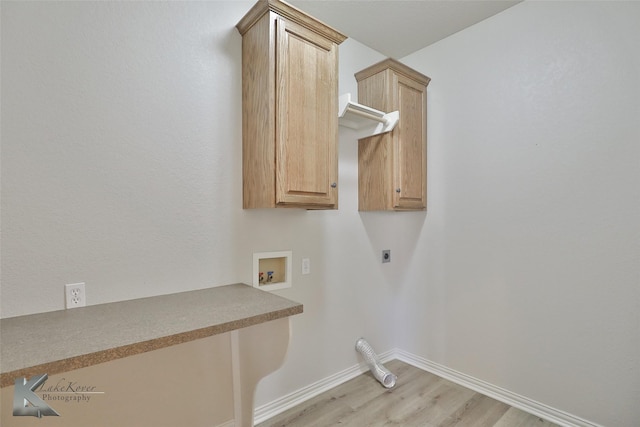 laundry area featuring washer hookup, light wood-type flooring, cabinets, and hookup for an electric dryer