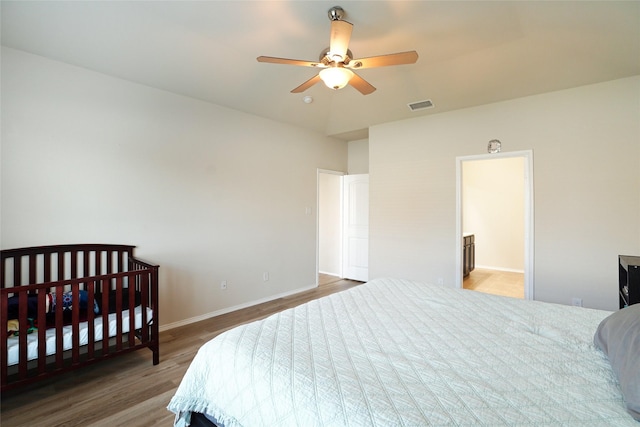 bedroom featuring hardwood / wood-style floors and ceiling fan